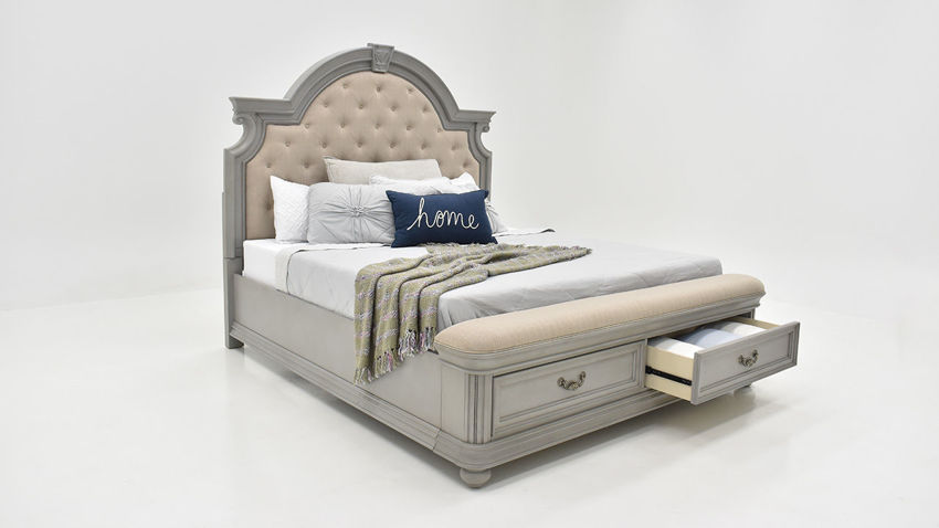 Slightly Angled View of the Keystone King Size Upholstered Storage Bed in Gray by Avalon Furniture | Home Furniture Plus Bedding