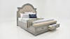 Slightly Angled View of the Keystone Queen Size Upholstered Storage Bed in Gray by Avalon Furniture | Home Furniture Plus Bedding
